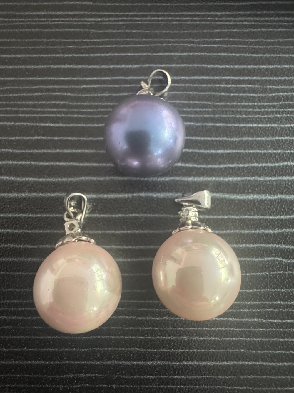 Three Pearls set in 18k GP setting. Weight from 4.3-5 grams.